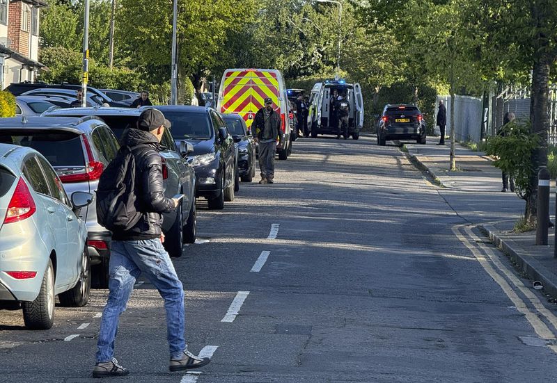 The area in London where police say a man wielding a sword attacked members of the public and two police officers on Tuesday, April 30, 2024 in the east London community of Hainault before being arrested. The incident is not being treated as terror-related. (Peter Kingdom via AP) MANDATORY CREDIT