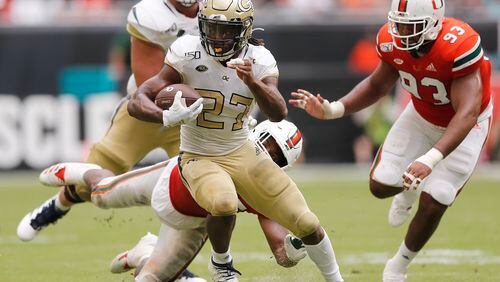 MIAMI, FLORIDA - OCTOBER 19:  Jordan Mason #27 of the Georgia Tech Yellow Jackets runs with the ball against the Miami Hurricanes during the second half at Hard Rock Stadium on October 19, 2019 in Miami, Florida. (Photo by Michael Reaves/Getty Images)