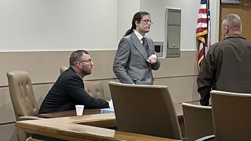 Neo-Nazi activist Michael Weaver, left, and attorney Justin Showalter, center, at a hearing in the Bartow County Courthouse in February 2023. In an opinion this month, the Georgia Court of Appeals refused to overturn a ruling dismissing his libel lawsuit, which required him to pay $20,000 in attorney fees.