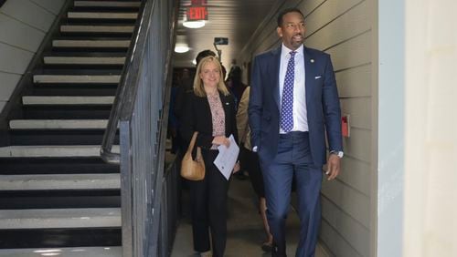 Mayor Andre Dickens takes a tour of The Villages of East Lake alongside Catherine Woodling of The East Lake Foundation on Monday, May 9, 2022. (Natrice Miller / natrice.miller@ajc.com)