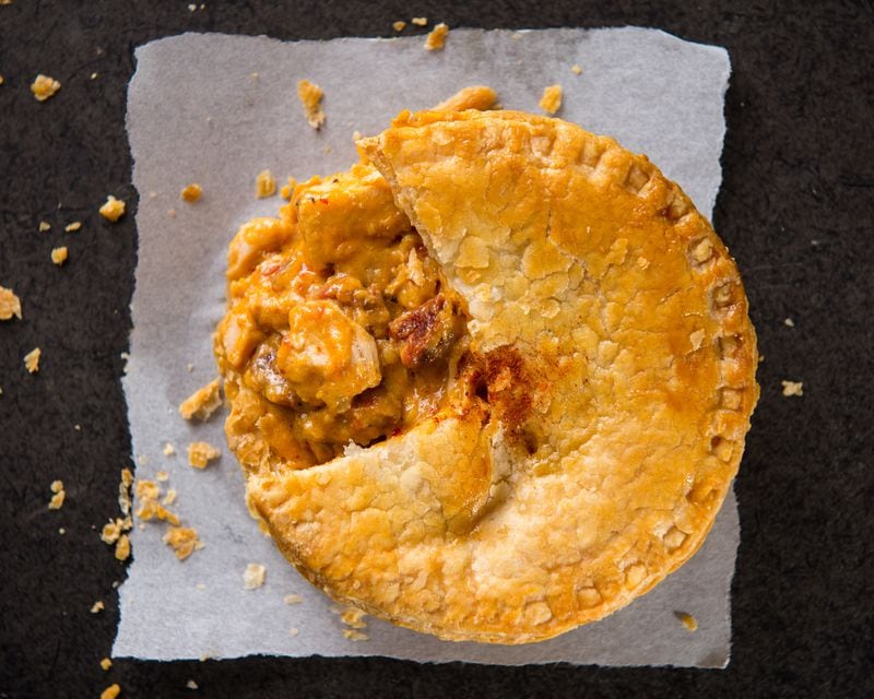 The flavors of Pouch Pies' fare, such as this spicy chicken and Portuguese chorizo pie, reflect the Malcher-Enslin family’s world travels. Courtesy of Justin Evans Photography