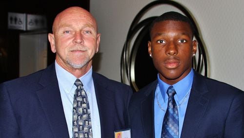 Former Elbert County Comprehensive High School quarterback Mecole Hardman takes a picture with his football coach, Sid Fritts. Hardman was the nation's No. 1 athlete in the class of 2016.