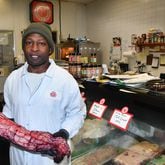 Diamond Mardell, owner of Shield's Meat Market in Emory Village, shows off a large cut of prime beef tenderloin in his shop. Shield's Meat Market has been serving as a butcher shop and grocery store for the Decatur area for more than 50 years. Chris Hunt for The Atlanta Journal-Constitution
