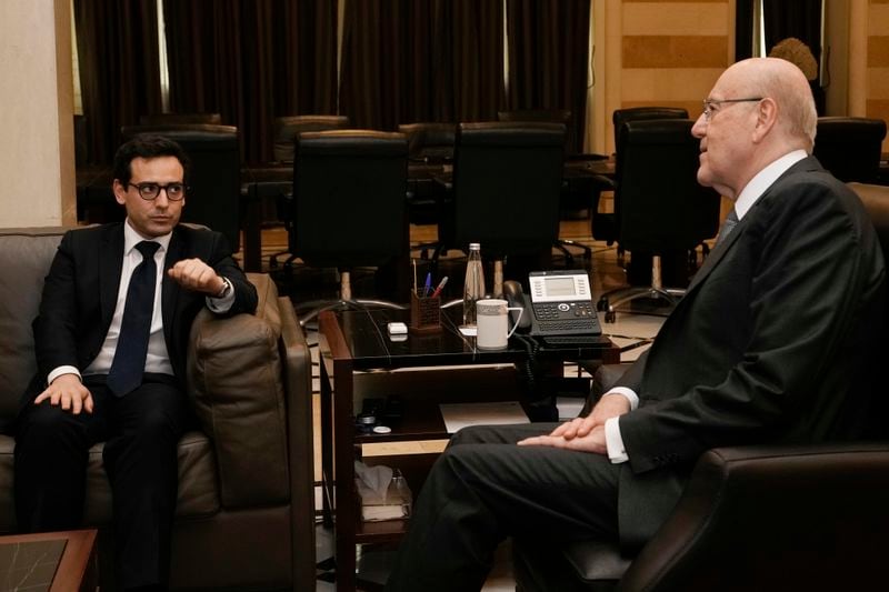 French Foreign Minister Stephane Sejourne, left, meets with Lebanese caretaker Prime Minister Najib Mikati, in Beirut, Lebanon, Sunday, April 28, 2024. (AP Photo/Hassan Ammar)