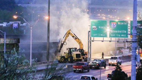 A portion of I-85 North and South remained closed Friday morning just south of Ga. 400 near Piedmont Road. (Photo: John Spink/jspink@ajc.com)
