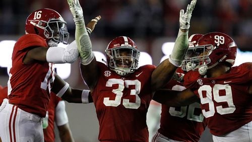 Another game, another Alabama celebration: This one featuring Anfernee Jennings (33) after his interception against Auburn. (Kevin C. Cox/Getty Images)