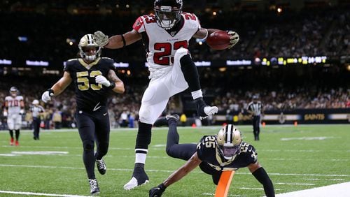 The Falcons Brian Hill scores in style last week against New Orleans. (Jonathan Bachman/Getty Images/TNS)