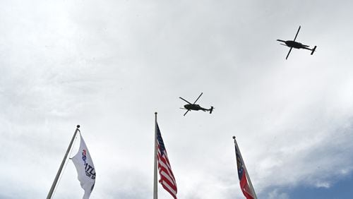 Two helicopters from Moody Air Force Base in Valdosta perform a fly-over before the start of the Quaker State 400 presented by Walmart Sunday, July 11, 2021, at Atlanta Motor Speedway in Hampton. (Hyosub Shin / Hyosub.Shin@ajc.com)