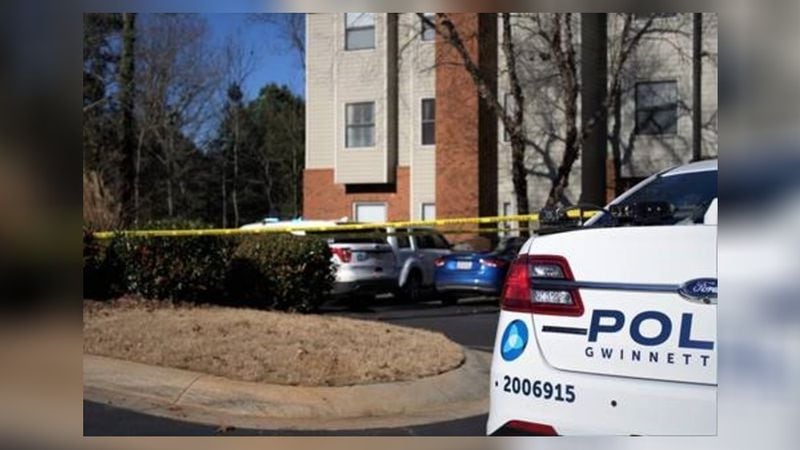 A homicide investigation and manhunt in the area of the Sugar Mill Apartments on Walther Road prompted a lockdown Thursday at nearby Georgia Gwinnett College.