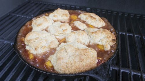 With a good grill, you can get a nice brown top on your peach cobbler biscuits. (Travis Heying/Wichita Eagle/TNS)