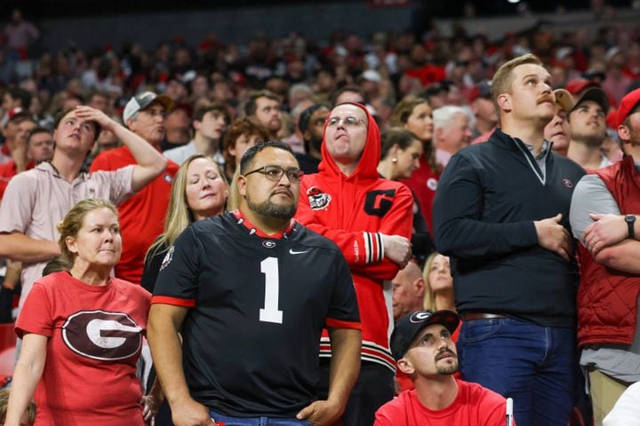 Georgia Bulldogs fans react in the final moments of the fourth quarter during the SEC Championship football game against the Alabama Crimson Tide at the Mercedes-Benz Stadium in Atlanta, on Saturday, December 2, 2023. Alabama defeated Georgia 27-24 to end the Bulldogs’ 29-game winning streak. (Jason Getz / Jason.Getz@ajc.com)
