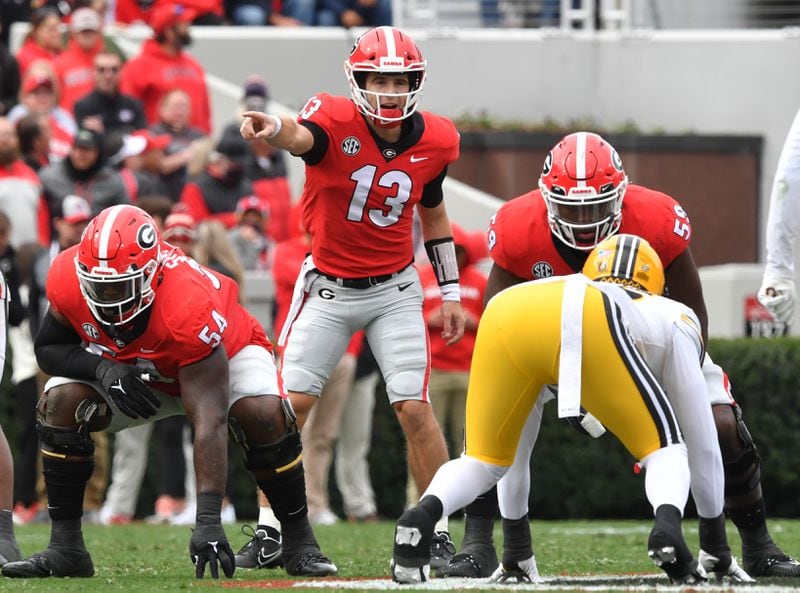 Georgia's quarterback Stetson Bennett (13) shouts an instruction before he plays in the first half during a NCAA football game at Sanford Stadium in Athens on Saturday, November 6, 2021. (Hyosub Shin / Hyosub.Shin@ajc.com)