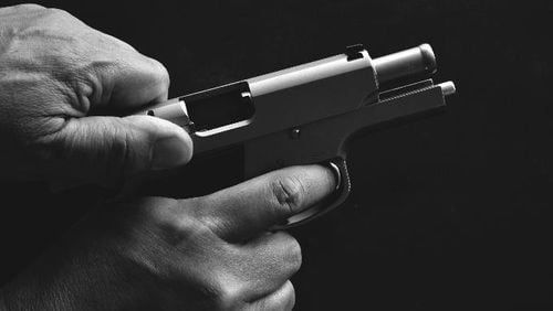 Photo illustration of a man holding a gun.