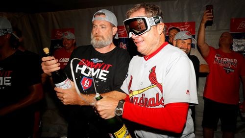 Manager Mike Shildt (right) of the St. Louis Cardinals celebrates in the locker room after his teams 13-1 win over the Atlanta Braves in game five of the National League Division Series at SunTrust Park on October 09, 2019 in Atlanta, Georgia. (Photo by Kevin C. Cox/Getty Images)