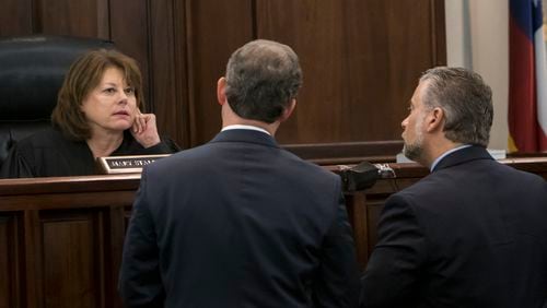 Cobb County Superior Court Judge Mary Staley Clark, left, confers with defense attorney Maddox Kilgore, right, and prosecutor Chuck Boring at the Ross Harris murder trial in Brunswick. (Stephen B. Morton for The Atlanta Journal Constitution)