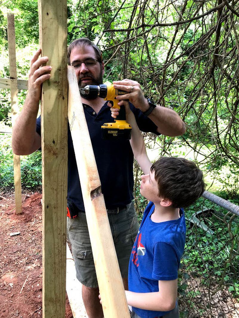 Douglas Mulford helps son Theodore with a power drill. Contributed by Douglas Mulford.