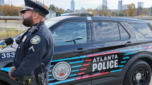 Atlanta police officer Kirk Bradshaw stands in front of his new patrol car Wednesday, November 2, 2022.   (Arvin Temkar / arvin.temkar@ajc.com)