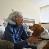 July 14, 2021 Smyrna - Rita Manatrizio plays with therapy dog Bella at her room at Woodland Ridge Assisted Living on Wednesday, July 14, 2021. (Hyosub Shin / Hyosub.Shin@ajc.com)
