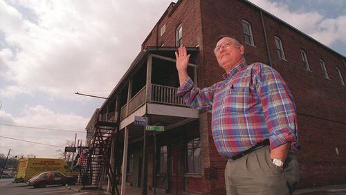 Former Kennesaw Mayor J.O. Stephenson waves to a friend while on Main Street in downtown Kennesaw (AJC File / Andy Sharp)