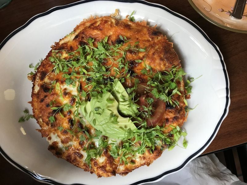 The all-volunteer staff at Café 458 dishes out a brunch menu that includes this highly filling frittata that’s packed with farm eggs, potatoes, chanterelles, onion and a cheese topped with avocado slices and microgreens. Photo credit: Ligaya Figueras