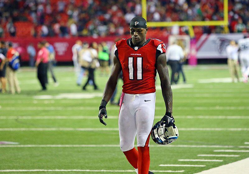 ****** VISUAL LEDE*****100713 Atlanta: -- OUT FOR THE YEAR? -- Falcons wide receiver Julio Jones walks off the field dejected after falling 30-28 to the Jets in their NFL "Monday Night Football" game on Monday, Oct. 7, 2013, in Atlanta. Jones may be out for the year with a foot injury. CURTIS COMPTON /staff CCOMPTON@AJC.COM It would be hard seeing this man walk away, I admit. (Curtis Compton/AJC photo)