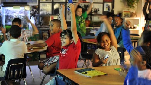 Students at Lilburn Elementary School celebrate after choosing the correct answer during an interactive science lesson in this file photo. Elementary students make up almost 45 percent of Gwinnett County students.