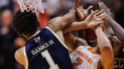 Tech’s James Banks III and Grant Williams of Tennessee fight for a loose ball during their matchup Nov. 13, 2018, at Thompson-Boling Arena in Knoxville, Tenn. Tennessee won the game 66-53.