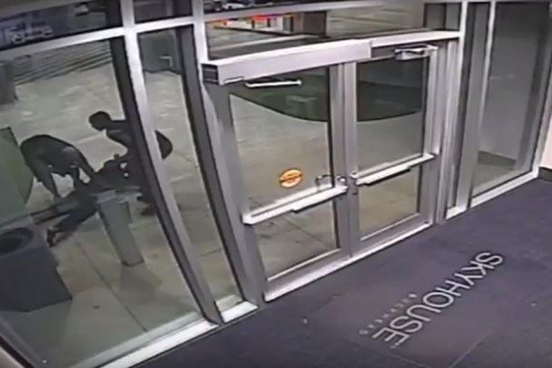 Surveillance footage shows armed men robbing a resident at the Skyhouse Buckhead. (Credit: Atlanta Police Department)