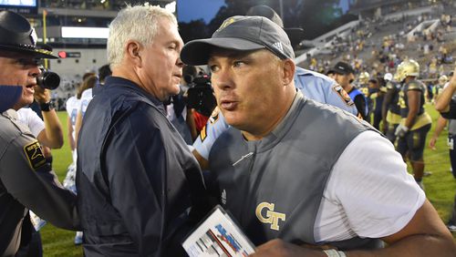 Georgia Tech coach Geoff Collins, right, and North Carolina coach Mack Brown meet up after a game against North Carolina, Saturday, Oct. 5, 2019, in Atlanta. North Carolina won 38-22. (John Amis/Special to the AJC)
