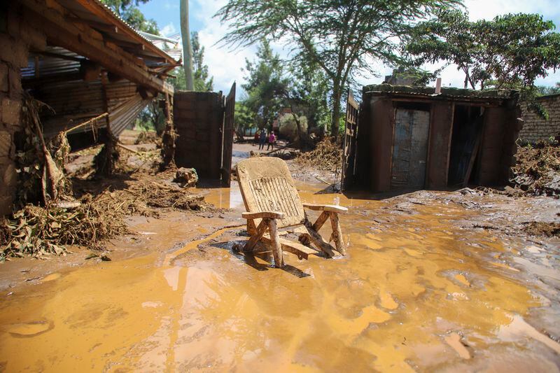 A chair stuck in the muddy water after a dam burst, in Kamuchiri Village, Mai Mahiu, Nakuru County, Kenya, Monday, April 29, 2024. Police in Kenya say at least 40 people have died after a dam collapsed in the country's west. (AP Photo/Patrick Ngugi)