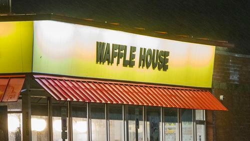 An alleged armed robber was shot and killed by a customer at a Villa Rica Waffle House, authorities said.