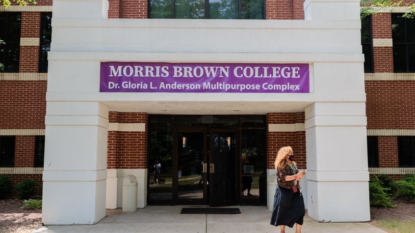 A week after classes began, Morris Brown College is once again requiring students and employees to wear face masks on campus. A person walks on Morris Brown’s campus on Monday, Aug. 15, 2022.  (Arvin Temkar / arvin.temkar@ajc.com)