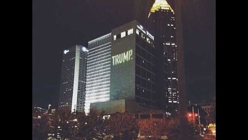 Those riding through Midtown saw “(Expletive) TRUMP” along the side of the Crowne Plaza hotel for about 30 minutes Sunday night, the Metro Atlanta Democratic Socialists of America said. (Credit: Instagram. Photo edited to obscure the expletive.)