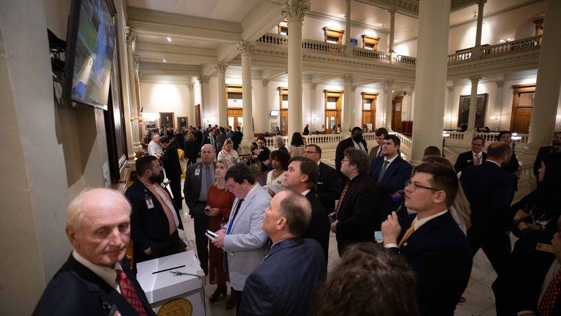 A group of lobbyists watch the sessions on Sine Die, the last day of the General Assembly at the Georgia State Capitol in Atlanta on Monday, April 4, 2022.   Branden Camp/ For The Atlanta Journal-Constitution