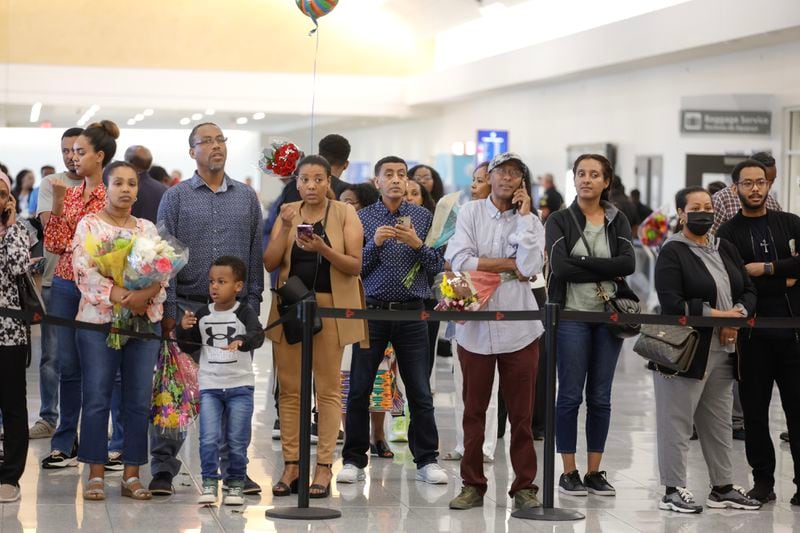 People wait for loved ones flying on the inaugural flight of Ethiopian Airlines as it arrives at Hartsfield-Jackson International Airport in Atlanta on Wednesday, May 17, 2023.  (Natrice Miller/natrice.miller@ajc.com)