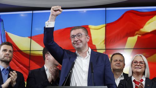 Hristijan Mickoski, the leader of the opposition center-right VMRO-DPMNE party celebrates after a news conference in Skopje, North Macedonia, on Wednesday, May 8, 2024. Citizens voted in North Macedonia on Wednesday in a parliamentary election and presidential runoff dominated by the country's slow path toward European Union membership and its sluggish economy. (AP Photo/Boris Grdanoski)