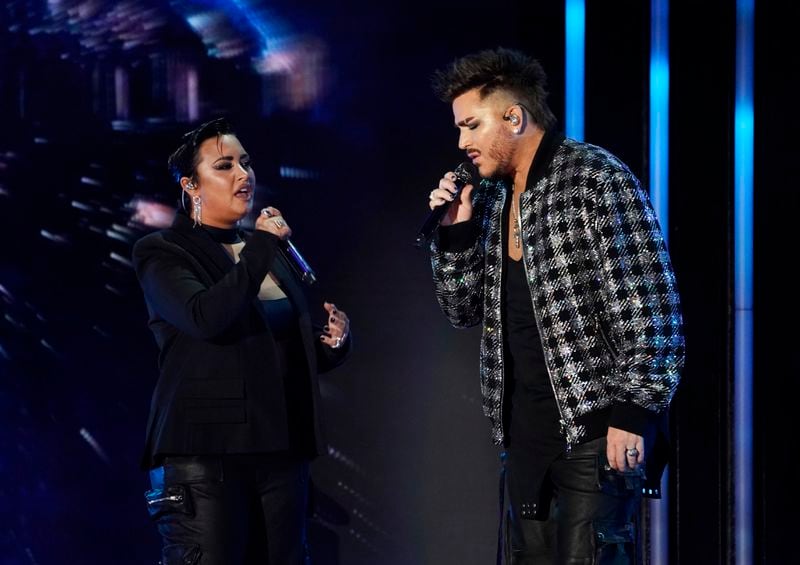 Demi Lovato, left, and Adam Lambert perform together during the 2021 Global Citizen Live event, Saturday, Sept. 25, 2021, at the Greek Theatre in Los Angeles. The 24-hour live event took place on six continents and featured recording artists and celebrities raising awareness around poverty, climate change and the need for more access to COVID-19 vaccine doses worldwide. (AP Photo/Chris Pizzello)