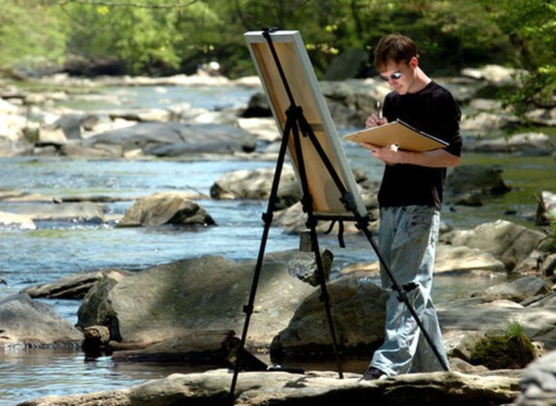 Art major Mark Verlander, of Kennesaw State University, enjoyed a relaxing and warm afternoon in 2018 painting on the banks of Sope Creek in the Chattahoochee River National Recreation Area near Atlanta.