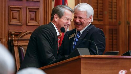 Gov. Brian Kemp (left) and Georgia Speaker of the House Jon Burns share a laugh following Kemp’s speech in the House chambers on March 29, the last day of the 2023 legislative session. (Natrice Miller/ natrice.miller@ajc.com)