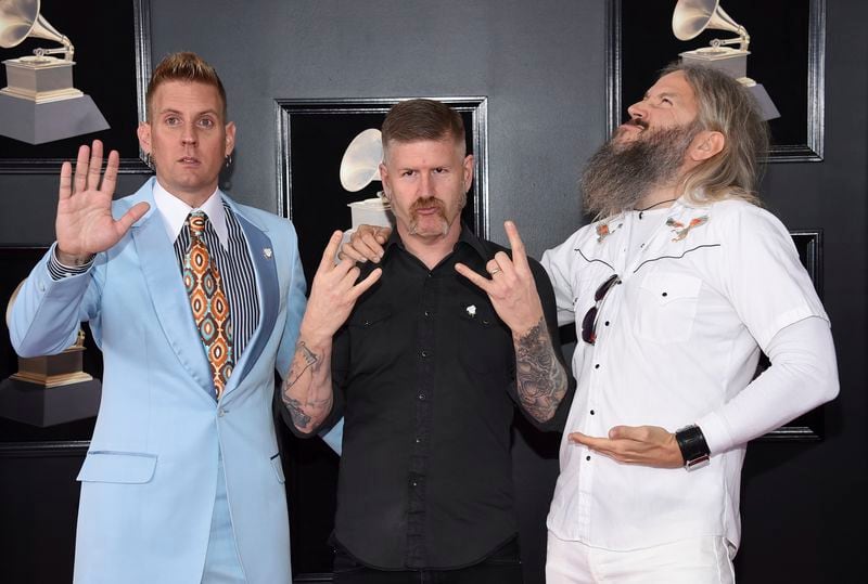  Brann Dailor, from left, Bill Kelliher and Troy Sanders of Mastodon arrive at the 60th annual Grammy Awards at Madison Square Garden on Sunday, Jan. 28, 2018, in New York. (Photo by Evan Agostini/Invision/AP)
