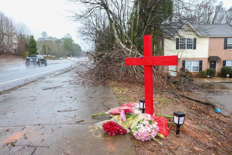 A memorial for University of Georgia football player Devin Willock and UGA football staff member Chandler LeCroy at the site where their automobile crashed on Barnett Shoals Road in January in Athens, Georgia. Willock and LeCroy died from their injures. (Jason Getz/The Atlanta Journal-Constitution/TNS)