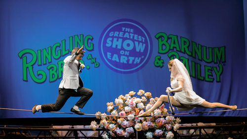 High wire walkers Mustafa Danguir and Anna Lebedeva, of Ringling Bros. and Barnum & Bailey exchange wedding vows 30 feet in the air on a wire that is no wider than a human thumb.