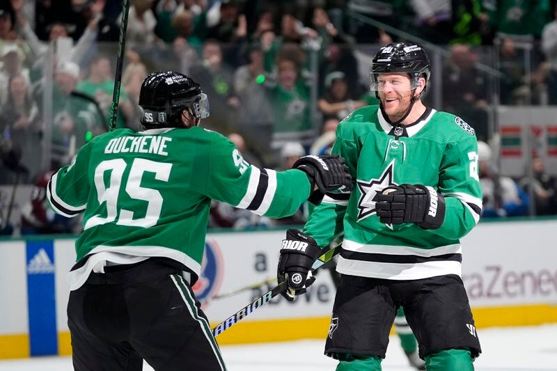 Dallas Stars' Matt Duchene (95) and Ryan Suter (20) celebrate after Suter scored in the first period in Game 2 of an NHL hockey Stanley Cup second-round playoff series against the Colorado Avalanche in Dallas, Tuesday, May 7, 2024. (AP Photo/LM Otero)