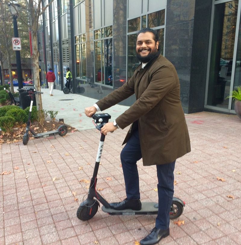 Amish Patel, an architect, rides a Bird electric scooter just about every day in downtown and Midtown Atlanta. He was spotted boldly occupying a left lane of Peachtree Street in rush-hour traffic. 