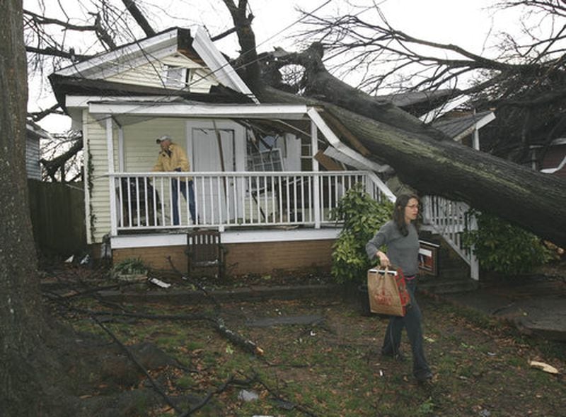 Then: The Cabbagetown area of Atlanta was one of the hardest hit by the tornado that tore through the city in March 2008. This house, at 252 Powell Street, was severely damaged.