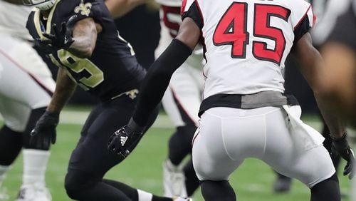 Falcons linebacker Deion Jones intercepts Saints quarterback Drew Brees during the third quarter in a NFL football game on Sunday, December 24, 2017, in New Orleans.