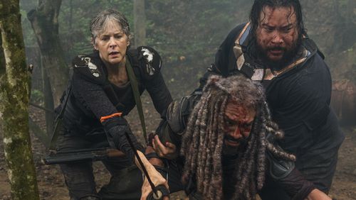 Melissa McBride (Carol), Khary Payton (King Ezekiel) and Cooper Andrews (Jerry) appear in “The Walking Dead.” The AMC show is filmed in Georgia. CREDIT: AMC