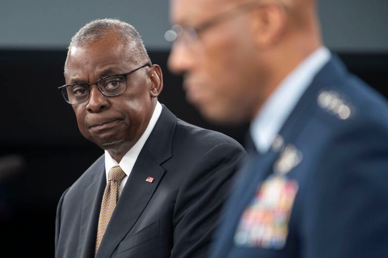 Defense Secretary Lloyd Austin, left, looks towards Chairman of the Joint Chiefs of Staff Gen. Charles Q. Brown Jr. during a press briefing on Friday, April 26, 2024 at the Pentagon in Washington. (AP Photo/Kevin Wolf)