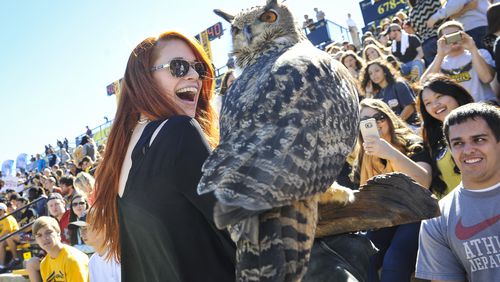 Kennesaw State student Kimberly Panik reacts to the school’s mascot, an owl named Sturgis.