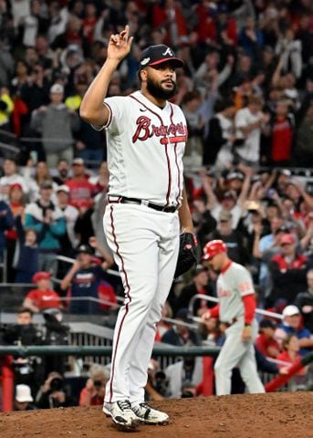 Atlanta Braves relief pitcher Kenley Jansen (74) signals a 3-0 win over the Philadelphia Phillies during the ninth inning of game two of the National League Division Series at Truist Park in Atlanta on Wednesday, October 12, 2022. (Hyosub Shin / Hyosub.Shin@ajc.com)